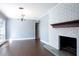 Dining room with hardwood floors and a white brick fireplace at 2148 Chippewa Trl, Maitland, FL 32751
