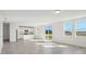 Open kitchen with island, stainless steel appliances, and granite countertops at 2462 Leeds St, Haines City, FL 33844