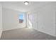 Well-lit bedroom featuring a window and sliding door closet at 2462 Leeds St, Haines City, FL 33844