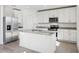 Bright kitchen with stainless steel appliances and granite island at 2462 Leeds St, Haines City, FL 33844