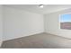 Simple bedroom with carpet, window, and neutral walls at 2462 Leeds St, Haines City, FL 33844