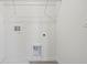 Laundry closet with shelving and hookups at 2462 Leeds St, Haines City, FL 33844