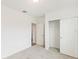 Bedroom with carpet flooring, a large closet, and access to another room at 2342 White Tail St, Davenport, FL 33837