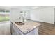 Kitchen with granite countertops and island at 2342 White Tail St, Davenport, FL 33837