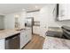 Modern kitchen with stainless steel appliances and island at 2342 White Tail St, Davenport, FL 33837