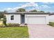 Newly built home with grey exterior and two-car garage at 2342 White Tail St, Davenport, FL 33837