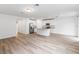 Open concept kitchen with island and view to living area at 2342 White Tail St, Davenport, FL 33837