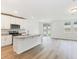 Open concept kitchen with island and patio access at 2342 White Tail St, Davenport, FL 33837