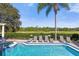 Enjoy this refreshing pool with multiple lounge chairs at 7481 Gathering Loop, Reunion, FL 34747