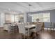 Elegant dining room features a large wooden table and comfortable seating for eight at 7481 Gathering Loop, Reunion, FL 34747