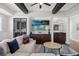 Relaxing bar area with sectional sofa and wet bar with storage at 7481 Gathering Loop, Reunion, FL 34747