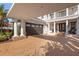 Covered parking area with brick pavers and columns at 7481 Gathering Loop, Reunion, FL 34747