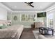 Spacious main bedroom with sitting area, large windows, and private access to the deck at 7481 Gathering Loop, Reunion, FL 34747