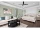 Main bedroom with sitting area, large windows, and private access to the deck at 7481 Gathering Loop, Reunion, FL 34747