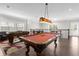 Game room with pool table and foosball for entertainment at 7481 Gathering Loop, Reunion, FL 34747