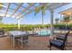 Inviting pool and spa with outdoor dining area and pergola at 7481 Gathering Loop, Reunion, FL 34747