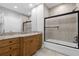 Bathroom with granite countertop, built-in vanity, and bathtub at 7481 Gathering Loop, Reunion, FL 34747
