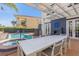 Inviting pool and spa with outdoor dining area and pergola at 7481 Gathering Loop, Reunion, FL 34747