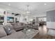 Spacious living area with multiple seating areas and an open floor plan at 7481 Gathering Loop, Reunion, FL 34747