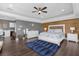 Main bedroom with a king-size bed, ample natural light, and access to a private balcony at 7481 Gathering Loop, Reunion, FL 34747