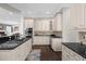 Spacious kitchen boasting ample cabinetry, granite countertops, and an island at 7481 Gathering Loop, Reunion, FL 34747