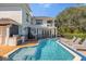 Resort-style pool with spa and ample lounge space at 7481 Gathering Loop, Reunion, FL 34747
