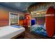 Beach-themed bedroom with bunk beds and a surfboard at 7481 Gathering Loop, Reunion, FL 34747