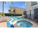Relaxing pool and spa area with plenty of lounge chairs for sunbathing at 7481 Gathering Loop, Reunion, FL 34747
