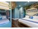 Beach-themed bedroom with a king-size bed and bunk beds at 7481 Gathering Loop, Reunion, FL 34747