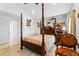 Main bedroom with a large four-poster bed at 2713 Chatham Cir, Kissimmee, FL 34746