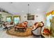 Spacious living room with ornate furniture, decorative rug, and large windows at 2713 Chatham Cir, Kissimmee, FL 34746
