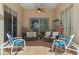 Relaxing patio with seating area, ceiling fan, and tiled floor at 2713 Chatham Cir, Kissimmee, FL 34746