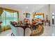 Elegant living room featuring ornate furniture, a decorative rug, and large windows at 2713 Chatham Cir, Kissimmee, FL 34746