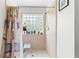 Shower stall with a built-in seat and window at 2713 Chatham Cir, Kissimmee, FL 34746