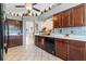 Kitchen with dark wood cabinets, white countertops, and a breakfast bar at 2713 Chatham Cir, Kissimmee, FL 34746