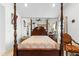 Main bedroom with a large four-poster bed at 2713 Chatham Cir, Kissimmee, FL 34746