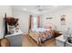 Bedroom with a double bed, white dresser, and decorative wall art at 2713 Chatham Cir, Kissimmee, FL 34746