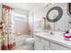 Clean bathroom with white vanity and bathtub at 2713 Chatham Cir, Kissimmee, FL 34746