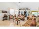 Open living room with a view of the kitchen and a cozy seating area at 2713 Chatham Cir, Kissimmee, FL 34746