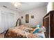 Bedroom with a double bed, mirrored closet doors, and wood flooring at 2713 Chatham Cir, Kissimmee, FL 34746