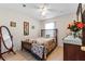Bright bedroom with a double bed, dresser, and wood flooring at 2713 Chatham Cir, Kissimmee, FL 34746