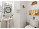 Small bathroom with pedestal sink and toilet at 2713 Chatham Cir, Kissimmee, FL 34746