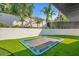Backyard with a trampoline surrounded by artificial turf at 238 E Lakeshore Dr, Clermont, FL 34711