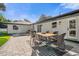 Patio with a wooden dining table and chairs, perfect for outdoor meals at 238 E Lakeshore Dr, Clermont, FL 34711