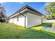 White house exterior showcasing modern design and landscaping at 238 E Lakeshore Dr, Clermont, FL 34711