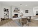 Living room featuring a stone fireplace and built-in shelving at 238 E Lakeshore Dr, Clermont, FL 34711