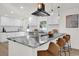 Modern kitchen with white shaker cabinets, granite countertops, and stainless steel appliances at 238 E Lakeshore Dr, Clermont, FL 34711