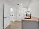 Clean laundry room, featuring gray cabinets and a large utility sink at 238 E Lakeshore Dr, Clermont, FL 34711
