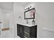 Stylish bathroom with dark vanity and marble flooring at 238 E Lakeshore Dr, Clermont, FL 34711