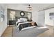 Modern bedroom with a sliding barn door and green accent wall at 238 E Lakeshore Dr, Clermont, FL 34711